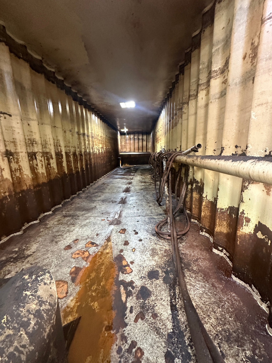 The interior of yellow Wichita 21,000 gallon frac tank #GP50053