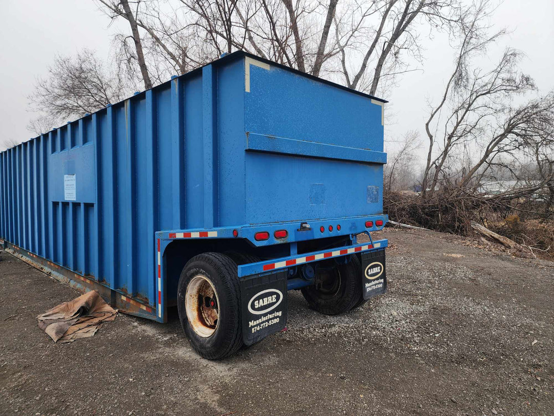 Rear view of the blue Sabre 21,000 gallon open top weir frac tank #41-0441